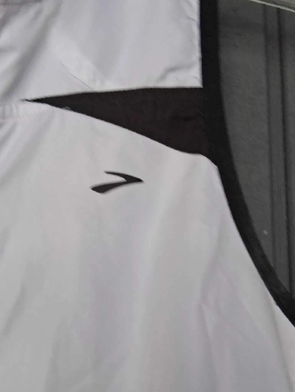 Brooks White and Black Sleeveless Zip-Front Running Vest - Picture 3 of 5